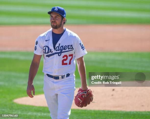 Trevor Bauer of the Los Angeles Dodgers pitches during a spring training game against the Colorado Rockies at Camelback Ranch on March 1, 2021 in...