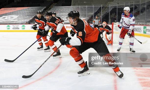 Travis Sanheim, Andy Andreoff and Carsen Twarynski of the Philadelphia Flyers set up the line of defense with Brian Elliott against Pavel Buchnevich...
