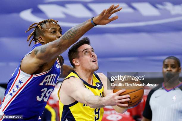 McConnell of the Indiana Pacers shoots under Dwight Howard of the Philadelphia 76ers during the second quarter at Wells Fargo Center on March 01,...