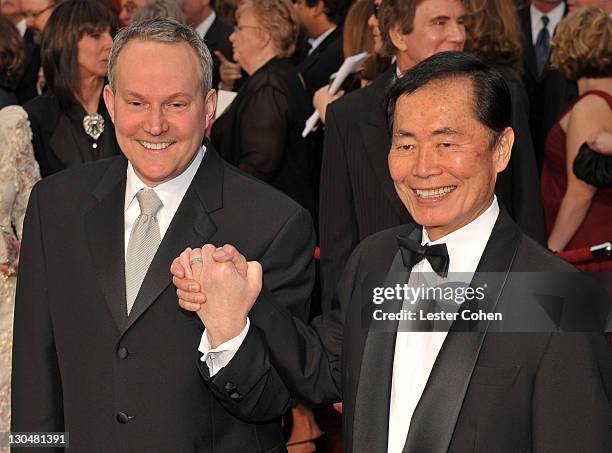 Producer Brad Altman and actor George Takai arrive at the 81st Annual Academy Awards held at The Kodak Theatre on February 22, 2009 in Hollywood,...