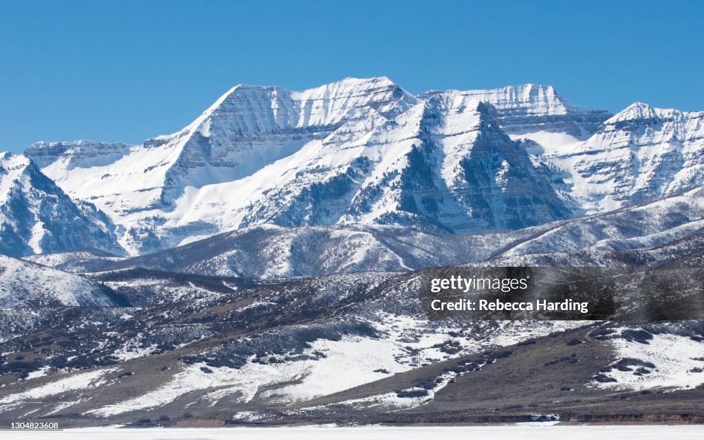 Snow Covered Mount Timpanogos rising above Deer Creek Reservoir in Utah on March 1, 2021