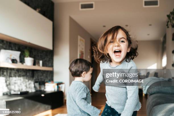 two little kids having fun at home. - brother toddler sister stockfoto's en -beelden