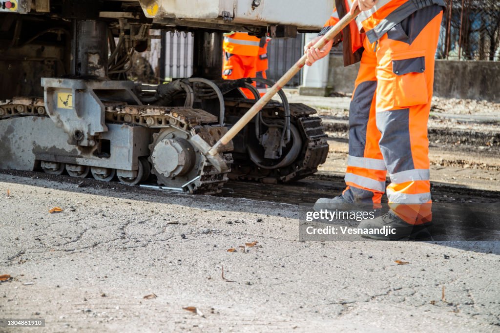 Arbeider op een wegenbouw, team van mensen op het werk