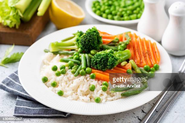 rice with steamed vegetables - vegetable fried rice stock-fotos und bilder