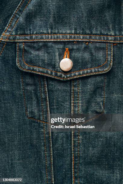 close up of a top quality of the detail of a blue denim jacket pocket. texture concept - denim jacket bildbanksfoton och bilder