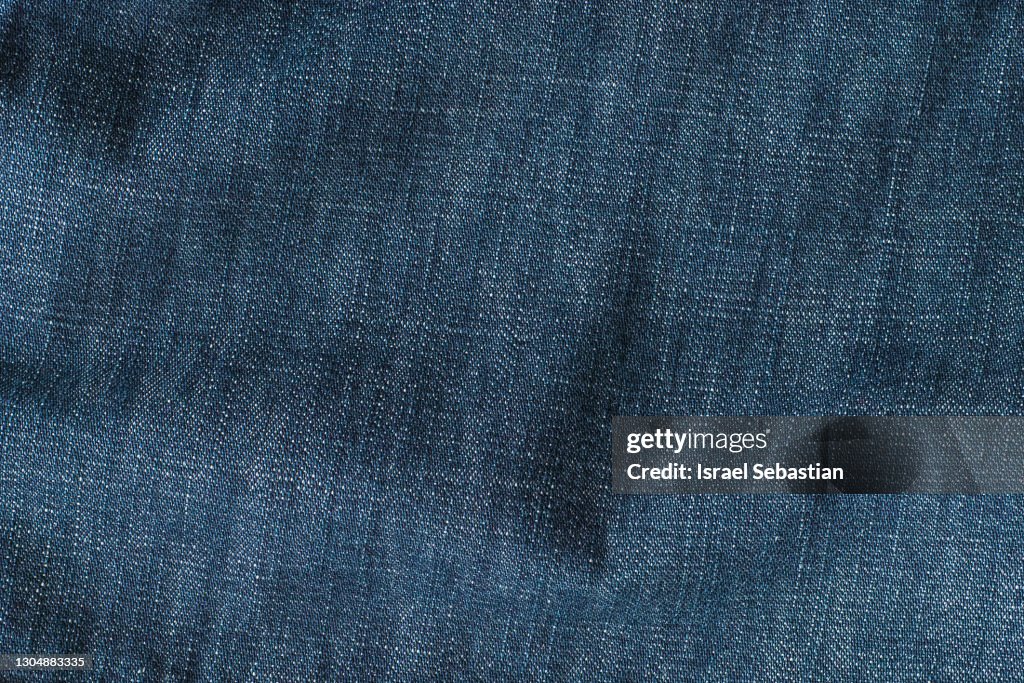 Close up of a texture of denim pants fabric. Texture and backgrop concept