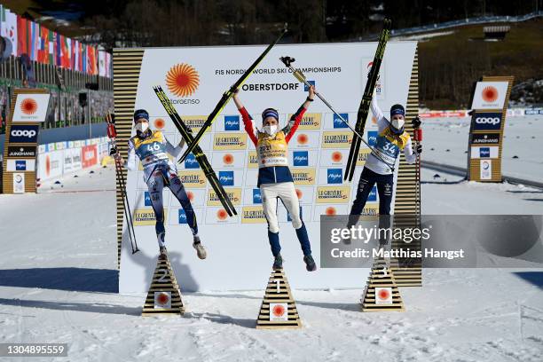 Frida Karlsson of Sweden, Therese Johaug of Norway and Ebba Andersson of Sweden celebrate their medals after the Women's Cross Country 10 km F at the...