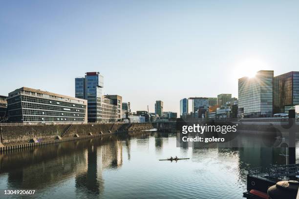 media harbor in dusseldorf at late summer afternoon - medienhafen stock pictures, royalty-free photos & images