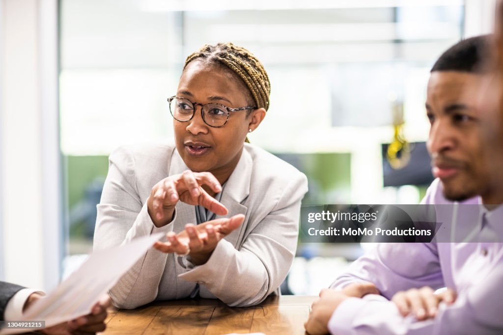 Businesswoman leading office discussion