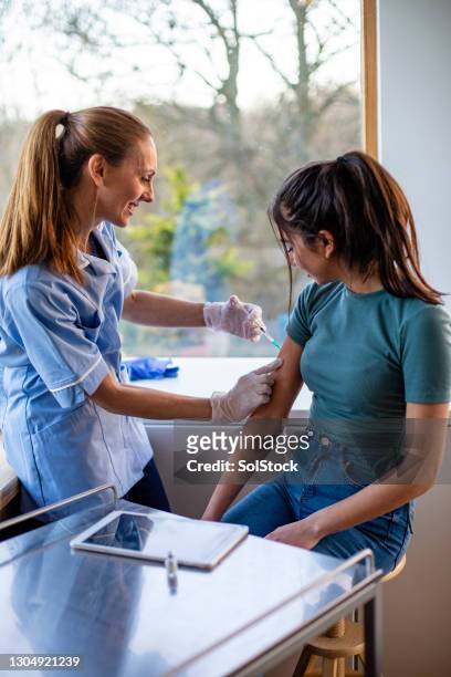 vaccine procedure - girl punch stock pictures, royalty-free photos & images