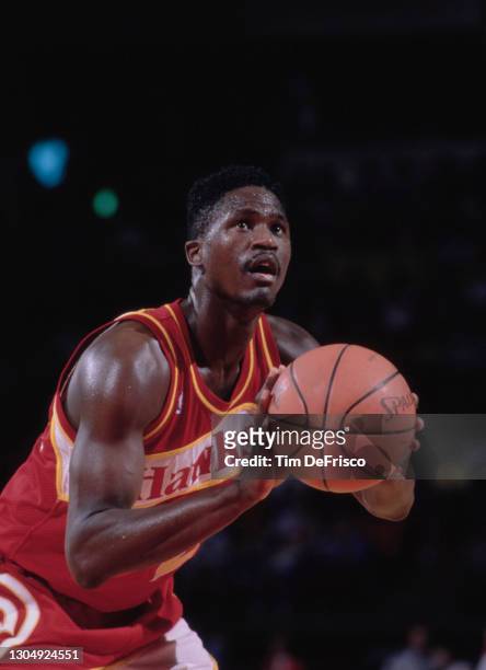 Dominique Wilkins, Small Forward for the Atlanta Hawks attempts a free throw during the NBA Midwest Division basketball game against the Denver...