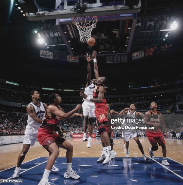 Dikembe Mutombo, Center for the Atlanta Hawks attempts to block the shot of Washington Wizard Point Guard Rod Strickland during their NBA Atlantic...