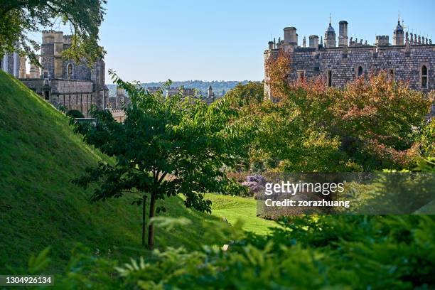 windsor castle building exterior and beautiful garden at sunny day, uk - berkshire stock pictures, royalty-free photos & images