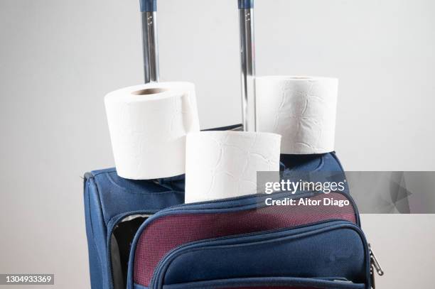 humor: toilet paper rolsl on a suitcase. - traveler's diarrhoea stock pictures, royalty-free photos & images