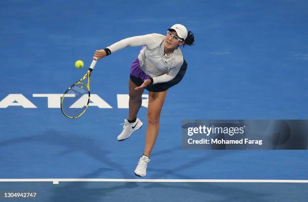 Saisai Zheng of China serves during the Women's Singles match between Saisai Zheng and Misaki Doi on Day Two of the WTA Qatar Total Open at Khalifa...