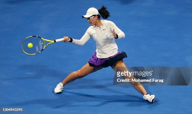 Saisai Zheng of China returns a forehand during the Women's Singles match between Saisai Zheng and Misaki Doi on Day Two of the WTA Qatar Total Open...