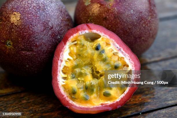 close-up of passion fruits on table,france - passion fruit imagens e fotografias de stock