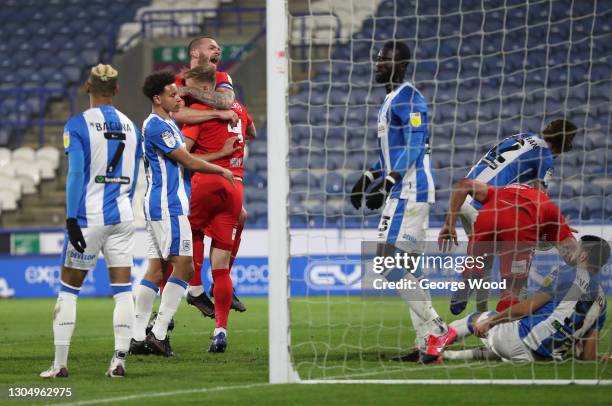 Marc Roberts of Birmingham City celebrates with team mate Harlee Dean after scoring their side's first goal during the Sky Bet Championship match...