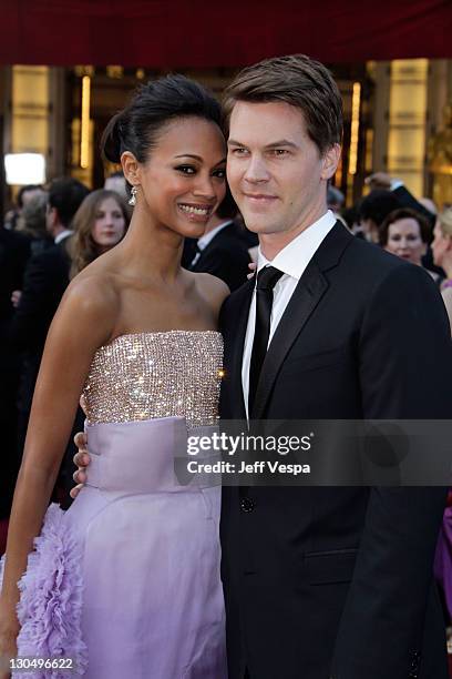 Actress Zoe Saldana and guest arrive at the 82nd Annual Academy Awards held at the Kodak Theatre on March 7, 2010 in Hollywood, California.