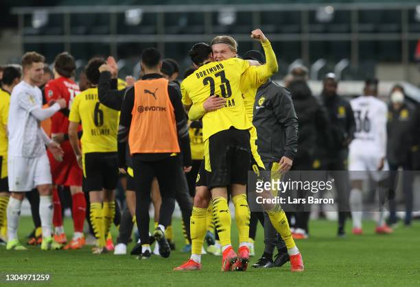 Erling Håland and Emre Can of Borussia Dortmund celebrate following the DFB Cup quarter final match between Borussia Mönchengladbach and Borussia...