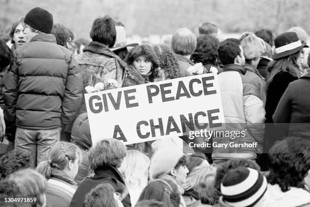 View of fans gathered near the Central Park bandshell during a memorial vigil for murdered musician John Lennon, New York, New York, December 14,...