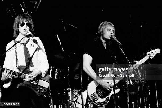 American New Wave and Pop musicians Elliot Easton , on guitar, and Ben Orr , on bass, both of the group the Cars, perform onstage at the Palladium,...