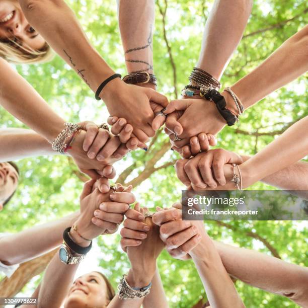 people all together connected in the park - dedication background stock pictures, royalty-free photos & images