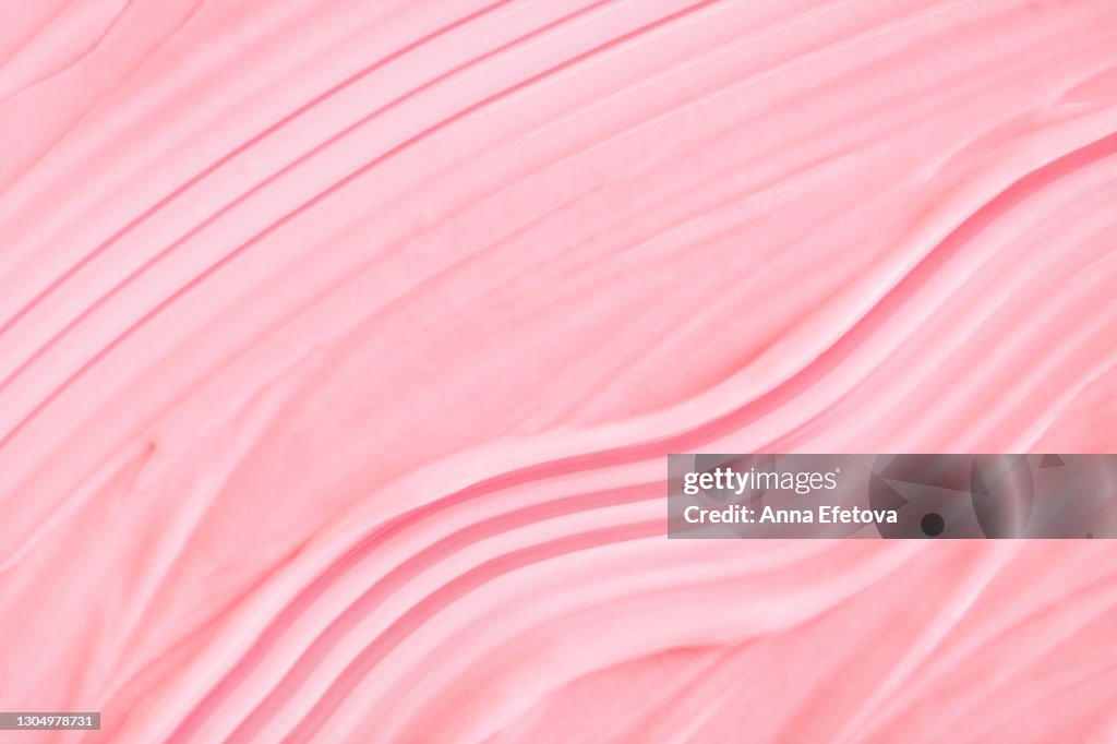 Textured pink smears of cream for beauty procedures. Trendy products of the year. Health and wellness concept