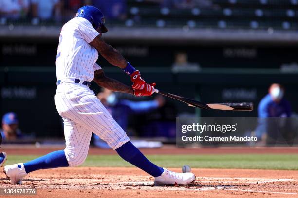 Jason Heyward of the Chicago Cubs breaks his bat prior as he reaches first base on a fielding error during the first inning of a preseason game...