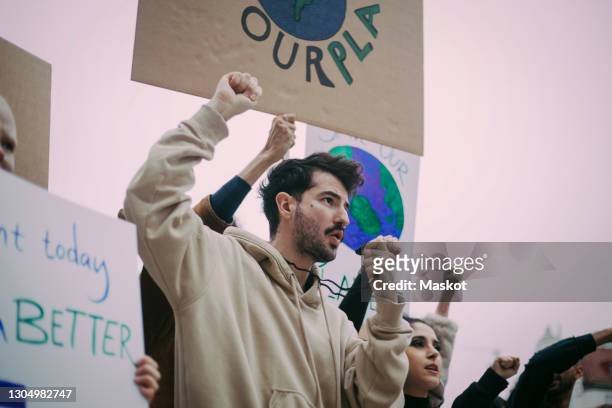 male and female activist during social movement - activist stock pictures, royalty-free photos & images