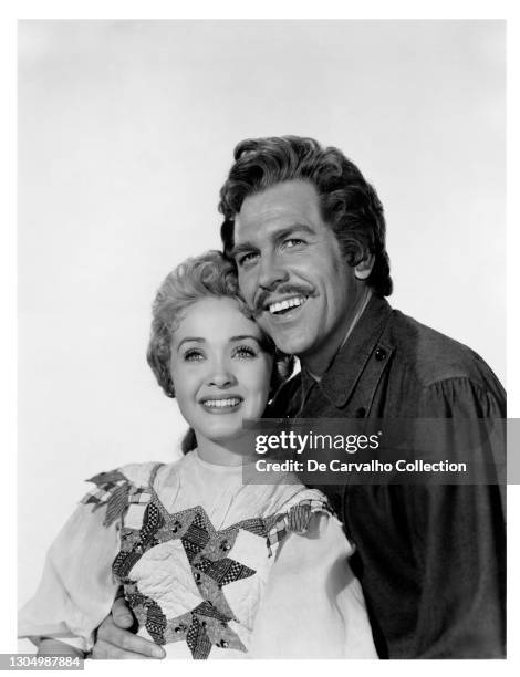 Actress and Singer Jane Powell as ‘Milly Pontipee’ and Actor and Singer Howard Keel as ‘Adam Pontipee’ in a publicity shot from the movie 'Seven...