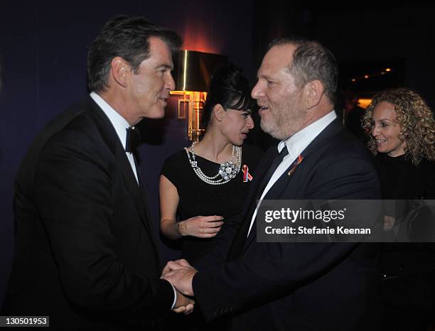 Actor Pierce Brosnan and produccer Harvey Weinstein attend the Weinstein Company Golden Globes after party co-hosted by Martini held at BAR 210 at...