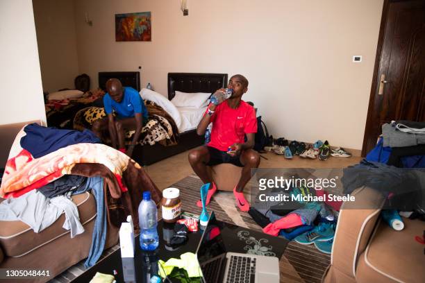 Mo Farah and training partner Abdi Abdirahman prepare for a morning run at their training camp accommodation on February 08, 2018 in Sululta, Addis...