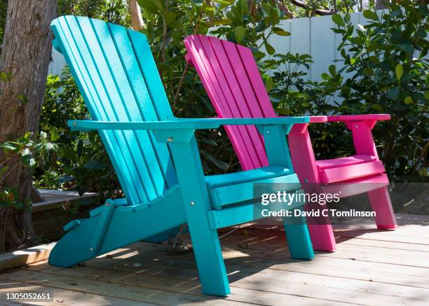 pair of colourful his and hers adirondack chairs on wooden deck, tavernier, key largo, florida, usa - symbolism stock pictures, royalty-free photos & images