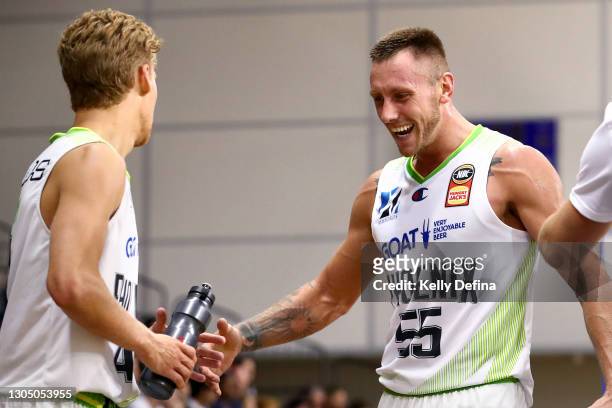 Mitchell Creek of the Phoenix and Kyle Adnam of the Phoenix react during the NBL Cup match between the Perth Wildcats and the South East Melbourne...