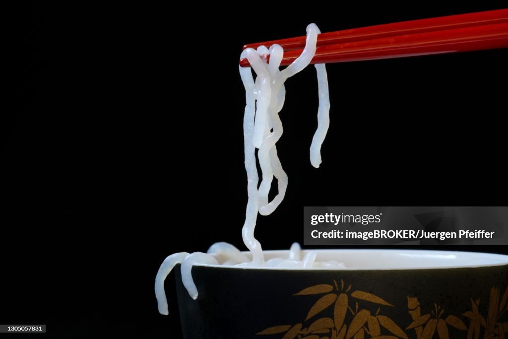 Shirataki noodles made from konjac flour on chopsticks, Germany