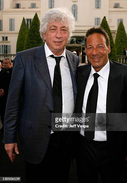 Producer Avi Lerner and Henry Winterstern attend the amfAR Cinema Against AIDS 2009 benefit at the Hotel du Cap during the 62nd Annual Cannes Film...