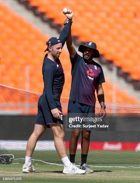 Jack Leach of England gets direction from Jeetan Patel spin bowling coach during a nets session at Narendra Modi Stadium on March 03, 2021 in...