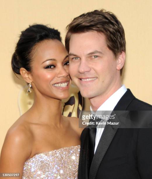 Actress Zoe Saldana and guest arrive at the 82nd Annual Academy Awards at the Kodak Theatre on March 7, 2010 in Hollywood, California.