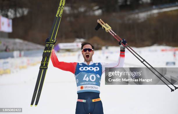 Hans Christer Holund of Norway celebrates winning the Men's Cross Country 15 km F at the FIS Nordic World Ski Championships Oberstdorf at...