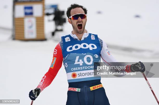 Hans Christer Holund of Norway celebrates winning the Men's Cross Country 15 km F at the FIS Nordic World Ski Championships Oberstdorf at...