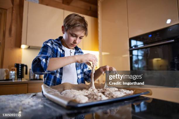 little boy making sourdough buns - poor kitchen stock pictures, royalty-free photos & images