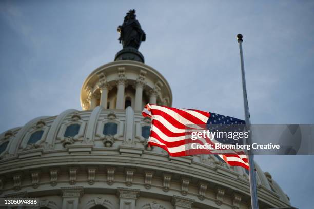the u.s. capitol building and american flag - funeral background stock pictures, royalty-free photos & images
