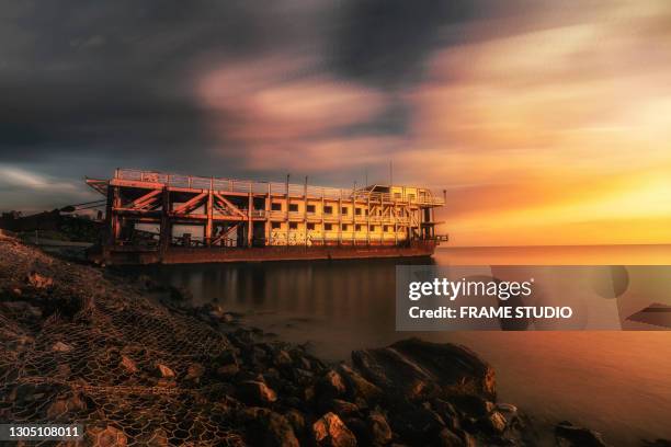 ruin ore carrier ship in thailand during sunset - undersea mines stock pictures, royalty-free photos & images