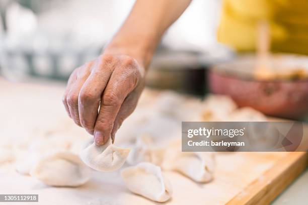 Dumpling Hand 1,511 Hands Making Dumplings Stock Photos, High-Res Pictures, and ...