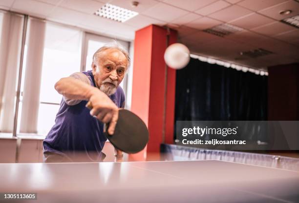 different generations play table tennis - table tennis stock pictures, royalty-free photos & images