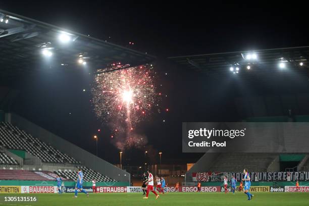 General view inside the stadium as fireworks are set off outside the groun during the DFB Cup quarter final match between Rot-Weiss Essen and...