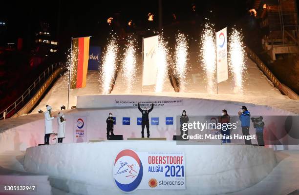 Silver medalist Sara Takanashi of Japan, Gold medalist Maren Lundby of Norway and Bronze medalist Nika Kriztnar of Slovenia celebrate during the...