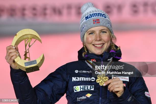 Gold medalist Maren Lundby of Norway celebrates during the medal ceremony for the Women's Ski Jumping HS137 competition at the FIS Nordic World Ski...