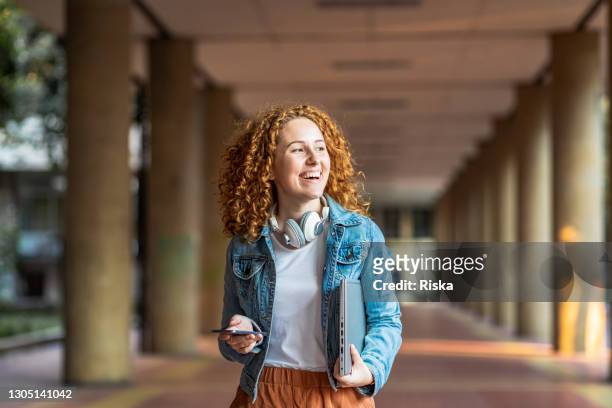 portrait of female college student with laptop - laptop outside stock pictures, royalty-free photos & images